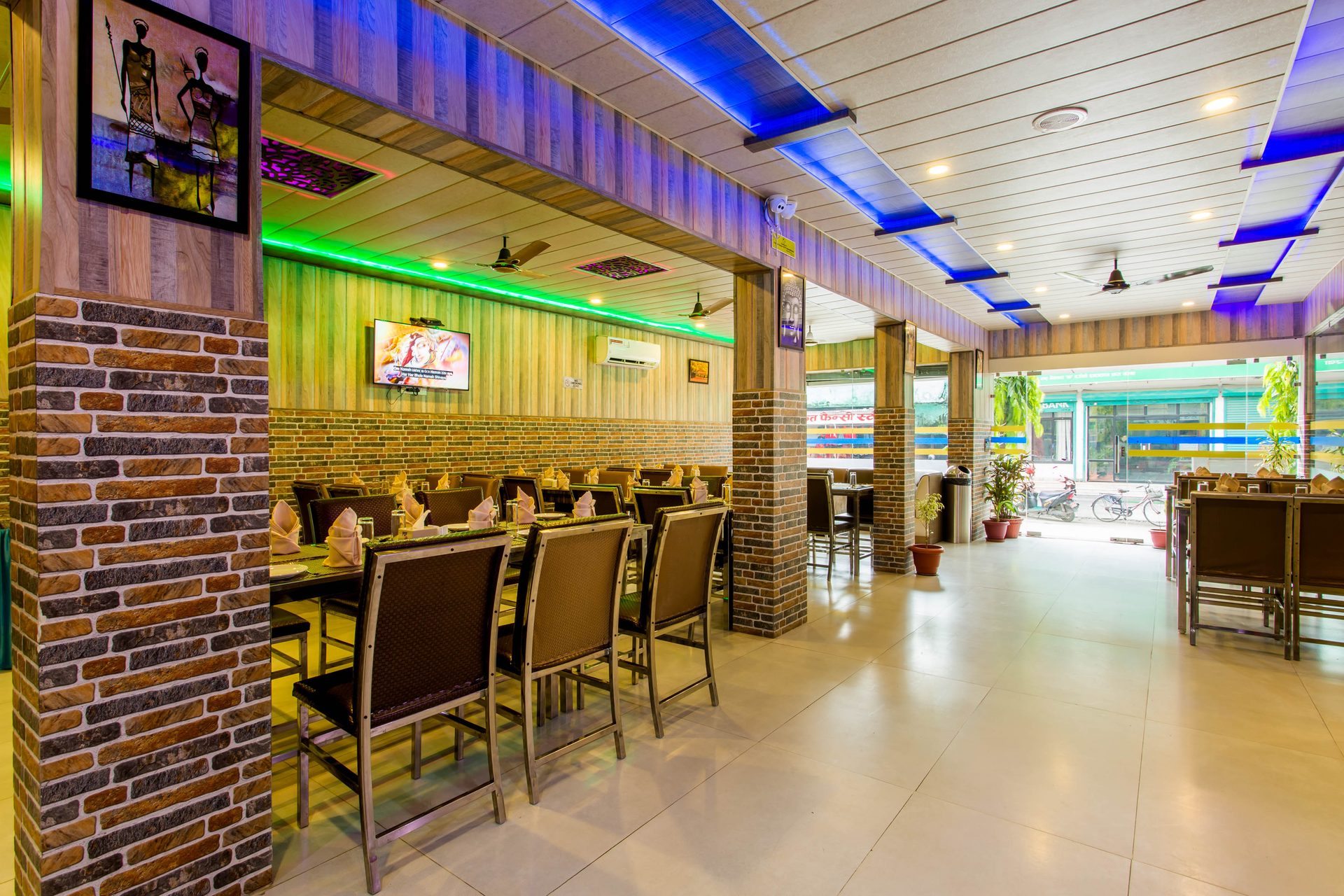 Anand Dining seating and street-facing windows